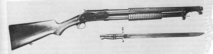 The military Model 1897 pump action shotgun with steel handguard and bayonet.