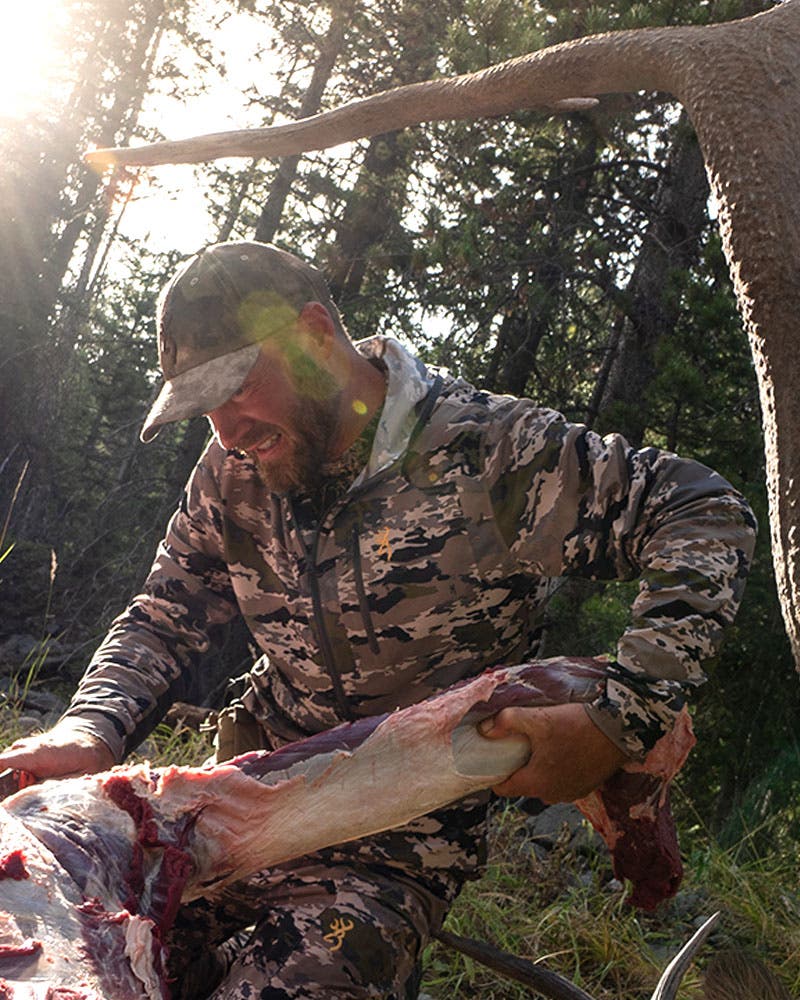 Hunter wearing OVIX camo harvesting bull elk