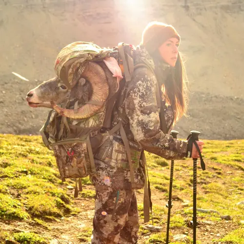 Female hunter on a Big Horn Sheep Pack Out