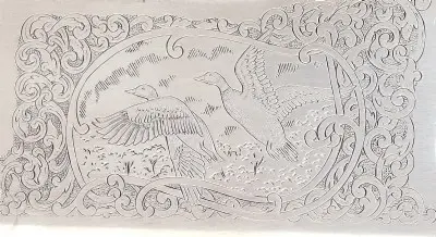 Engraving on Citori over and under shotgun receiver.