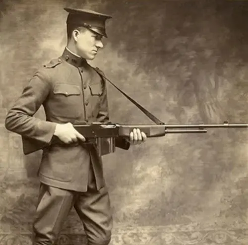 Lt. Val A. Browning, son of the famous inventor displays the Browning BAR. 