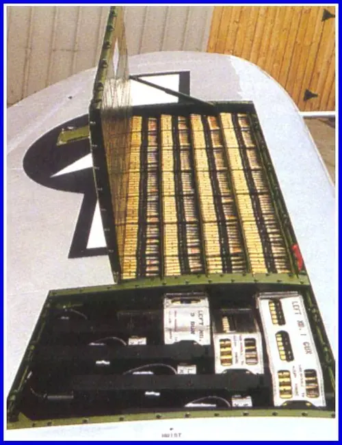 Rows of 50 BMG ammo lined up inside airplane wing