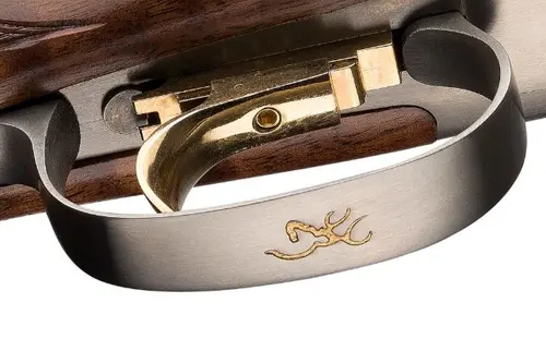 Buckmark logo on trigger guard of Citori over and under shotgun.