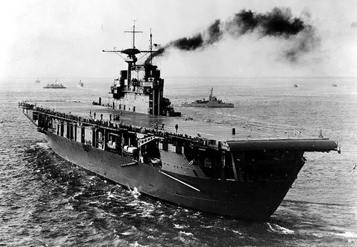 The American fleet carrier USS Hornet heads to sea. 