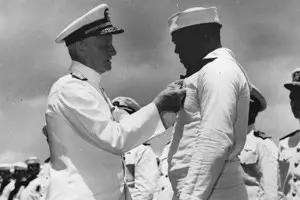 Doris “Dorie” Miller receives the Navy Cross from Admiral Chester Nimitz, CIC-Pacific Fleet.