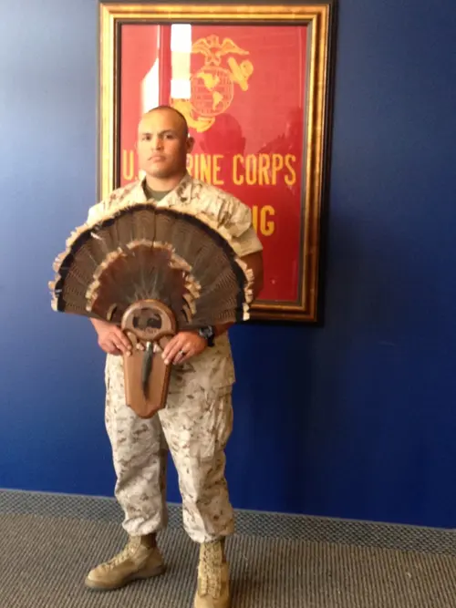 Staff Sargent Derek Bamba with turkey tail fan