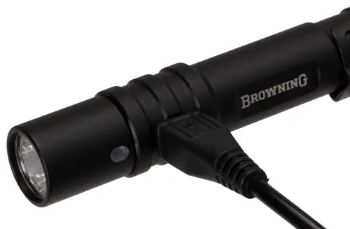 Flashlight plugged into USB charging cord.