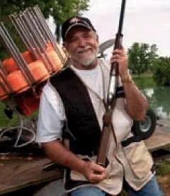 Johnny Meitzen with shotgun and clay thrower