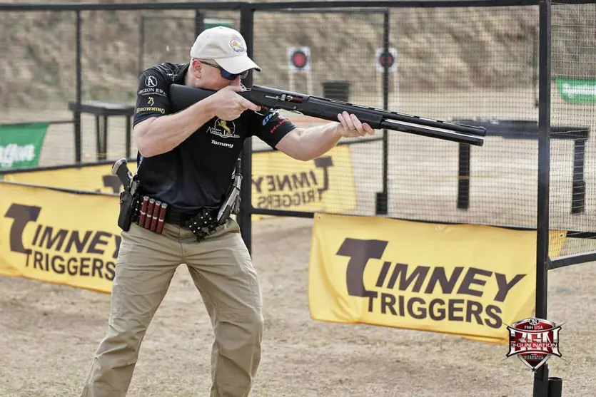 Tommy Thacker firing an A-5 shotgun in a 3 gun competition