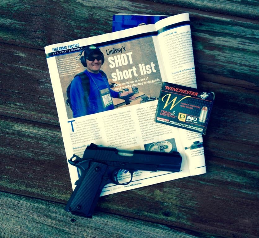 Law Enforcement Technology Magazine with 1911-380 pistol sitting on it.