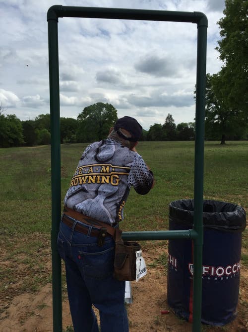 Sporting clays target shooting at stand aiming to shoot.