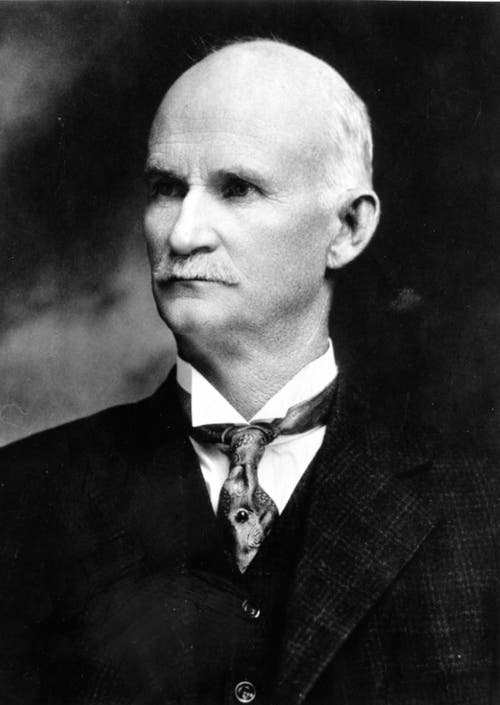 John M Browning portrait in tie
