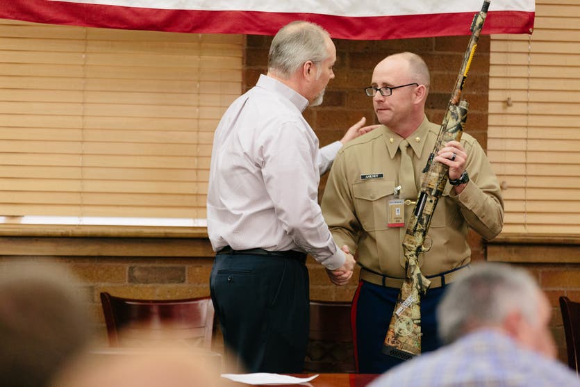 Veteran presented shotgun by Browning's president.