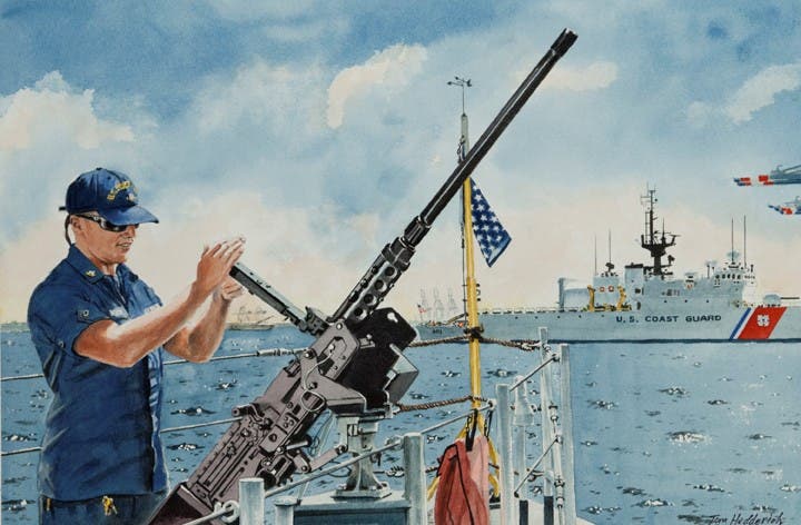 A USCG deck gunner inspects his 50 caliber Browning machine gun.