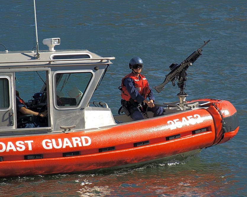 The USCG patrols an American harbor, armed with the FN M240 machine gun. 