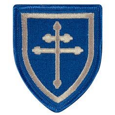 The US Army’s 79th Infantry Division shoulder patch, the Cross of Lorraine.