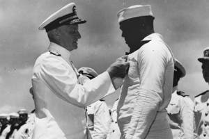 Doris “Dorie” Miller receives the Navy Cross from Admiral Chester Nimitz, CIC-Pacific Fleet.