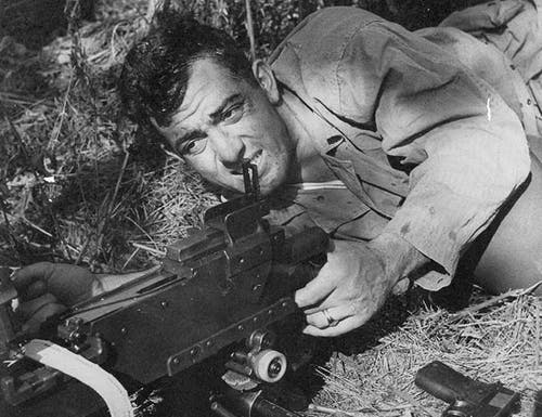 Sgt. Basilone brings his Browning machine gun into action. Note Basilone’s John M. Browning designed Model 1911 pistol was always within easy reach.