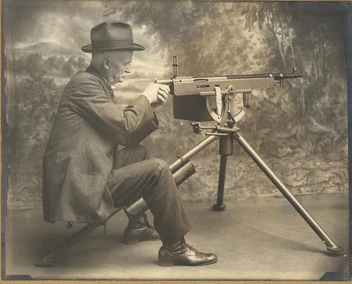 John M. Browning demonstrates his Model 1895 belt-fed machine gun.