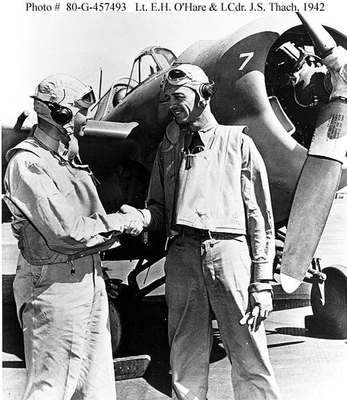 LT Butch O’Hare and LCDR John Thach shake hands after a successful mission together. 