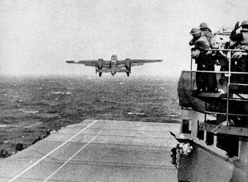 B25 bomber taking off from carrier.