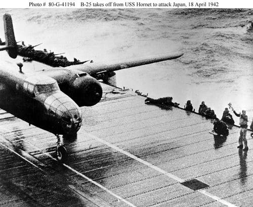 With both engines at full power an Army B-25 starts down the flight deck of the Hornet.