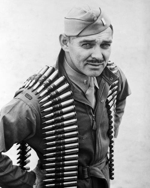 Commanding General of the U.S. Army Air Forces Henry H. "Hap" Arnold shown with a belt of 50s over his shoulders. 