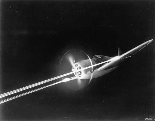 An early variant of the Republic P-47 on a night strafing run. 