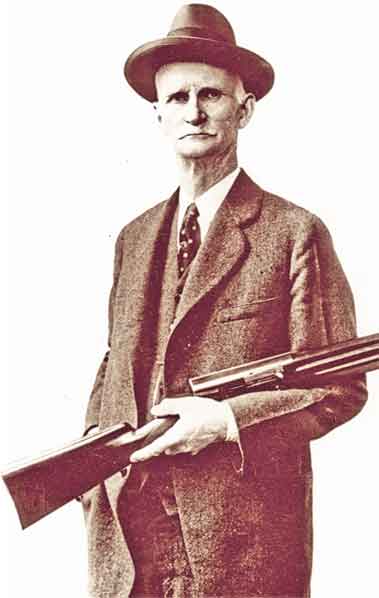John M Browning portrait holding Auto-5 Shotgun
