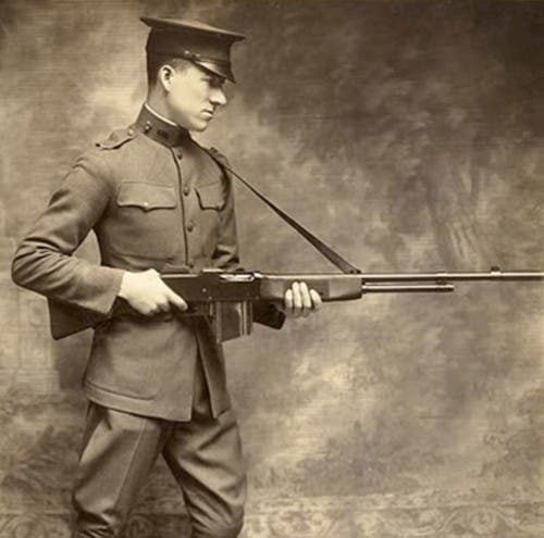 Lt. Val A. Browning, son of the famous inventor displays the Browning BAR. 