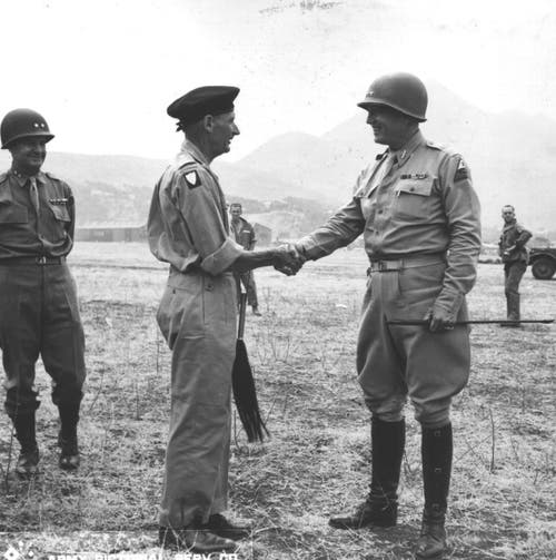 Generals Montgomery and Patton shake hands 