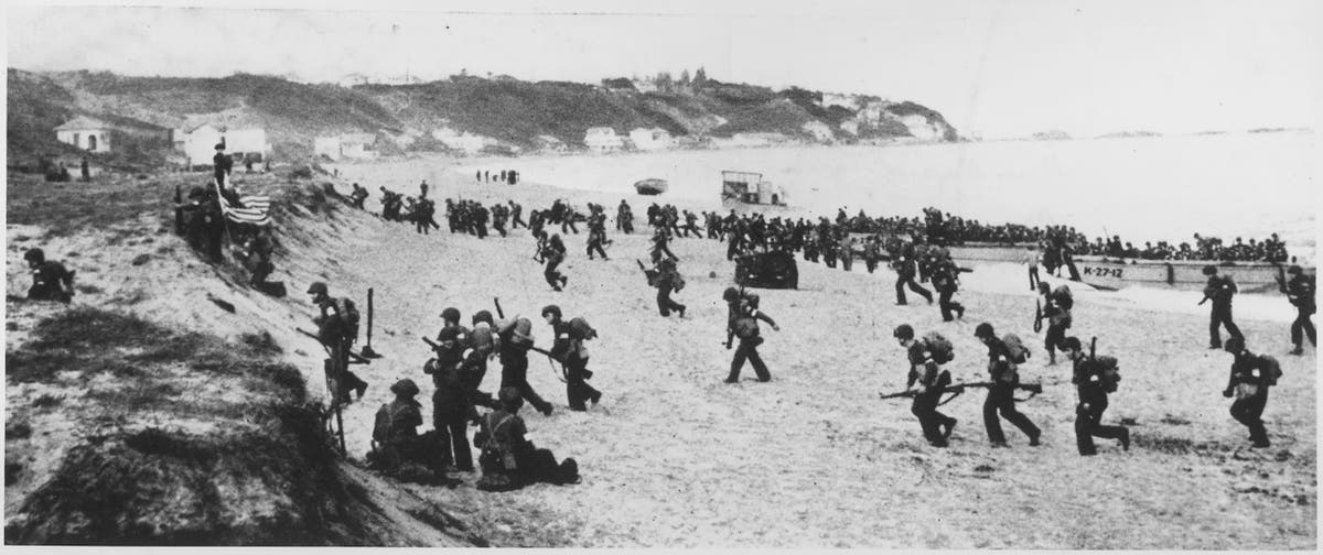American troops cross the beach on the morning of November 8, 1943 during Operation Torch.