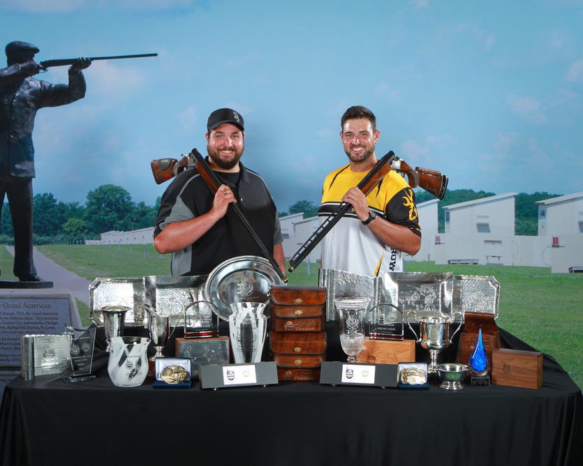 Matt and Foster Bartholow with Citori over under shotguns and 28 trophies