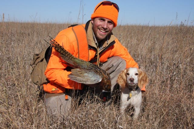 Anthony Hauck with dog and pheasant