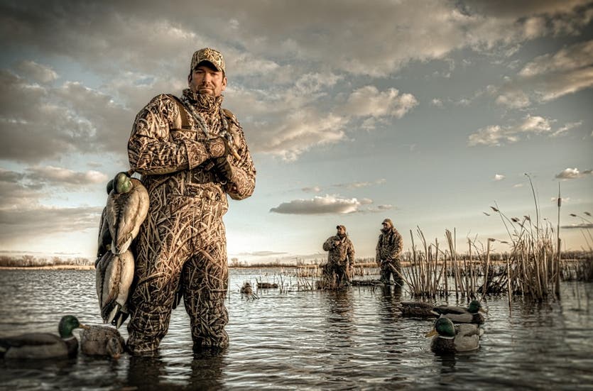 Fred Zink in marsh with decoys