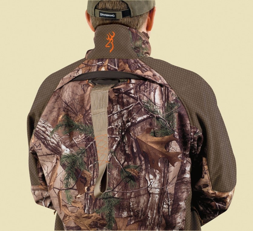 Tree stand safety harness access through the back of hunting jacket.