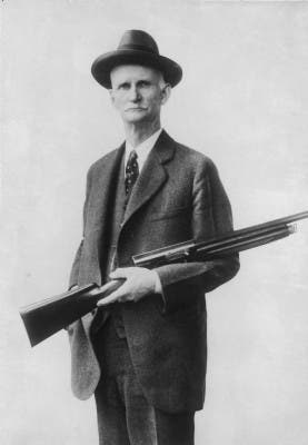 John M. Browning holding semi-auto Auto-5 shotgun