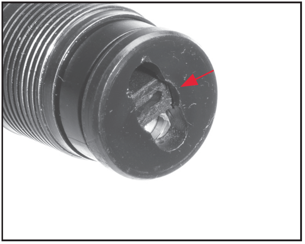 The three-shot adaptor (plug) shown secured in the magazine tube.