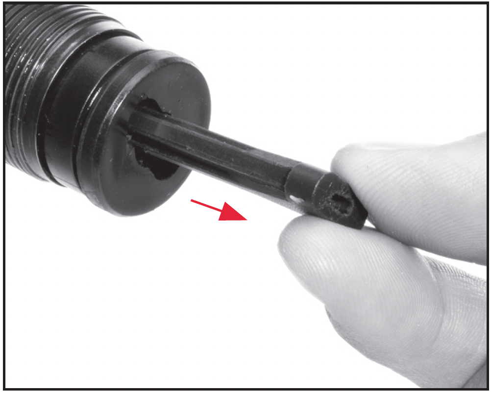 Remove the three-shot adaptor (plug).